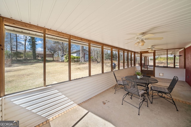 sunroom / solarium featuring ceiling fan