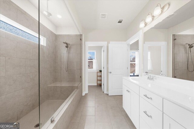 2401 Cotton Gin Row, Jefferson, GA 30549 - full bathroom featuring visible vents, tile patterned floors, a tile shower, and vanity