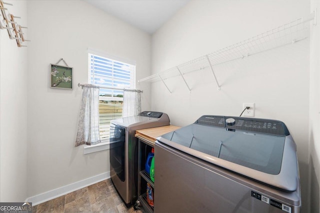 2401 Cotton Gin Row, Jefferson, GA 30549 - laundry room with baseboards, laundry area, stone finish floor, and washer and dryer