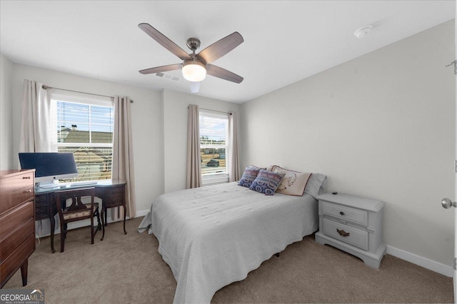 2401 Cotton Gin Row, Jefferson, GA 30549 - bedroom featuring light colored carpet, a ceiling fan, baseboards, and multiple windows