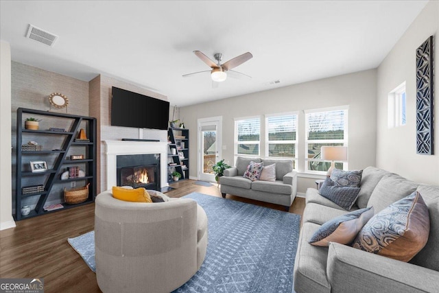 2401 Cotton Gin Row, Jefferson, GA 30549 - living room featuring visible vents, a fireplace with flush hearth, and a wealth of natural light