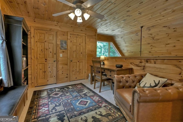 sitting room with carpet floors, lofted ceiling, wooden ceiling, and wood walls