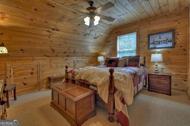 bedroom featuring light carpet, wooden ceiling, lofted ceiling, and wooden walls