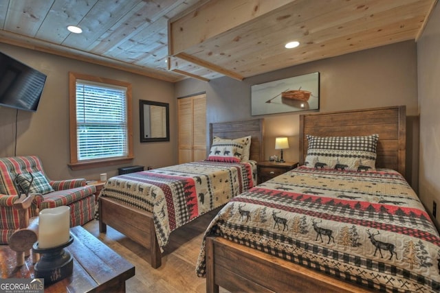 bedroom with wood finished floors, wood ceiling, and recessed lighting