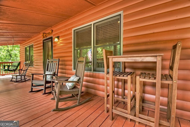 wooden terrace with covered porch