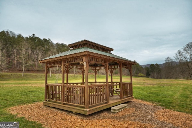 surrounding community featuring a gazebo and a yard