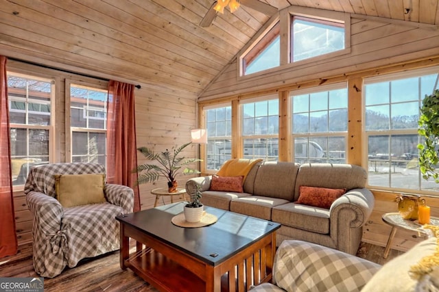 664 River Vista Dr, Dillard, GA 30537 - living room with wooden walls, dark wood-type flooring, lofted ceiling, wooden ceiling, and a ceiling fan
