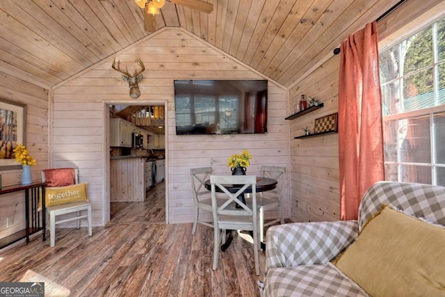 664 River Vista Dr, Dillard, GA 30537 - dining space featuring wooden walls, vaulted ceiling, wood ceiling, hardwood / wood-style floors, and ceiling fan