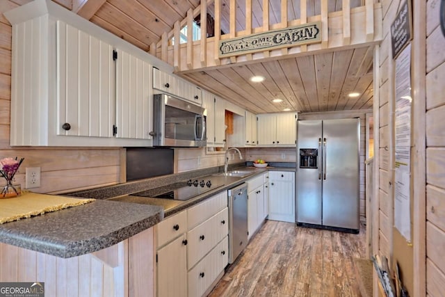 664 River Vista Dr, Dillard, GA 30537 - kitchen with appliances with stainless steel finishes, light wood-type flooring, wood ceiling, dark countertops, and recessed lighting