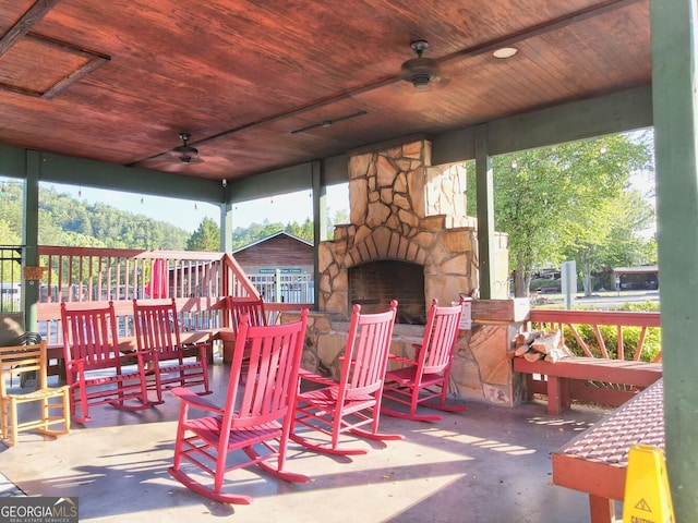 664 River Vista Dr, Dillard, GA 30537 - view of patio / terrace with a ceiling fan and an outdoor stone fireplace