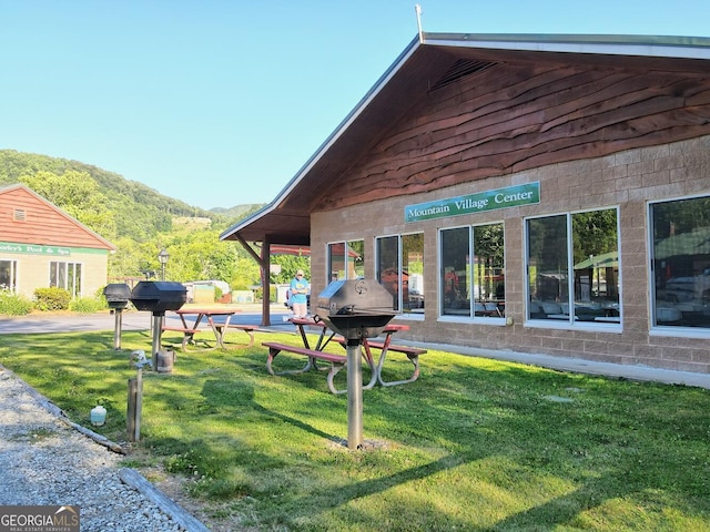 664 River Vista Dr, Dillard, GA 30537 - view of home's exterior with a mountain view and a yard