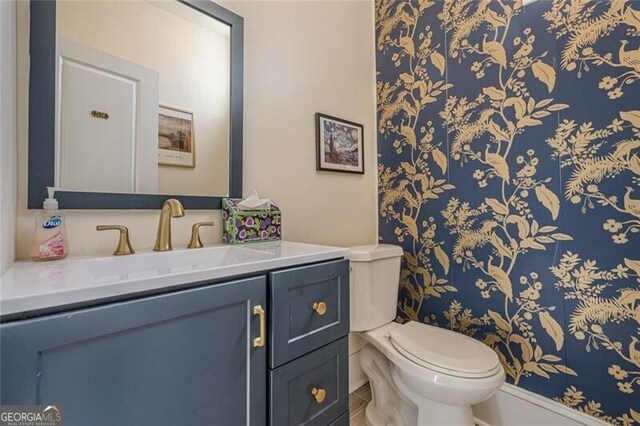 bathroom with vanity and toilet