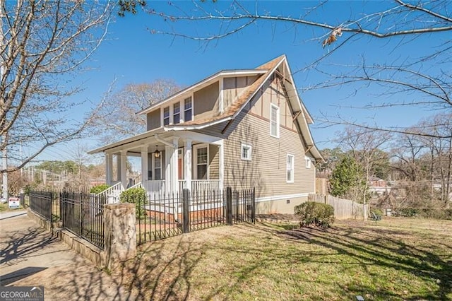 view of front of home featuring a fenced front yard, crawl space, and covered porch