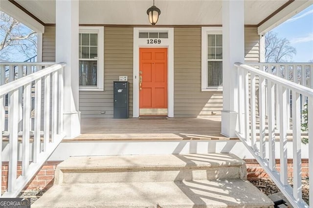 entrance to property featuring covered porch