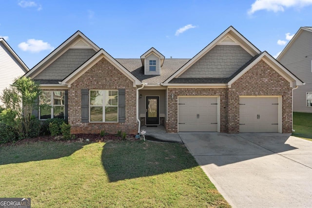 craftsman-style home with driveway, a shingled roof, an attached garage, a front lawn, and brick siding