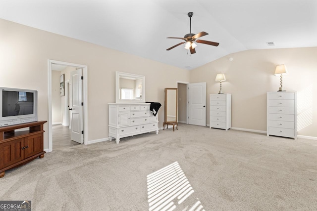 carpeted bedroom featuring lofted ceiling, baseboards, visible vents, and ceiling fan