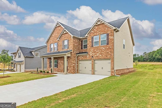 view of front of home with an attached garage, a front lawn, concrete driveway, and brick siding