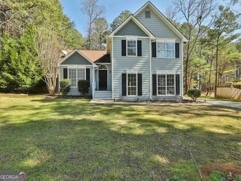 view of front of property with a front lawn