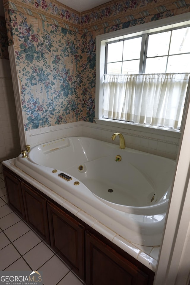 bathroom featuring a jetted tub, tile patterned floors, and wallpapered walls