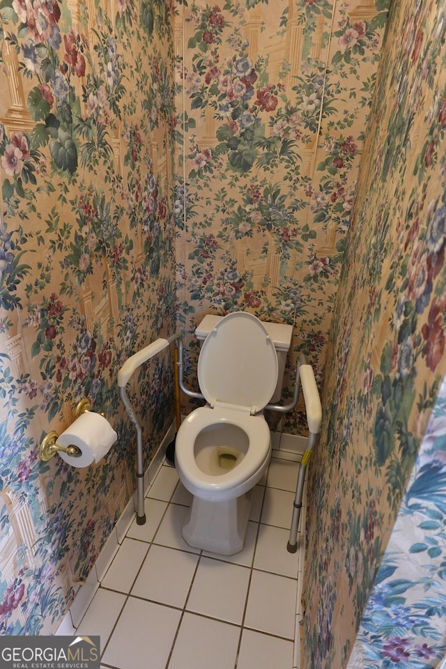 bathroom with tile patterned flooring and toilet