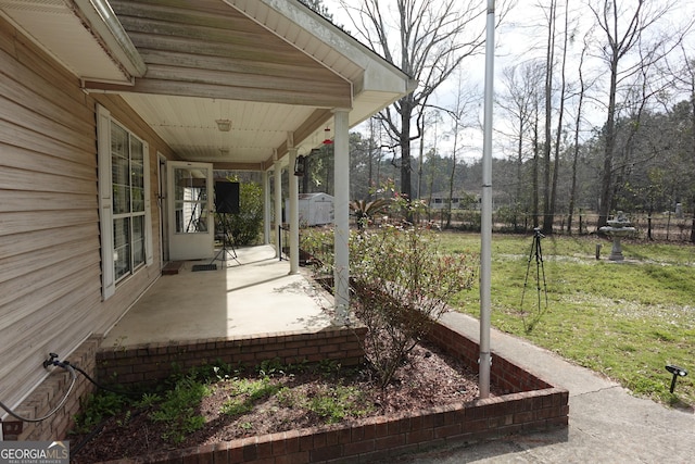 view of patio / terrace featuring fence