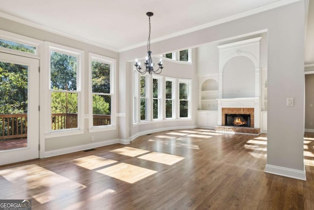 unfurnished sunroom with a fireplace and a notable chandelier