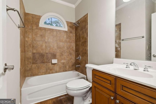 bathroom with ornamental molding, shower / bathing tub combination, vanity, and toilet