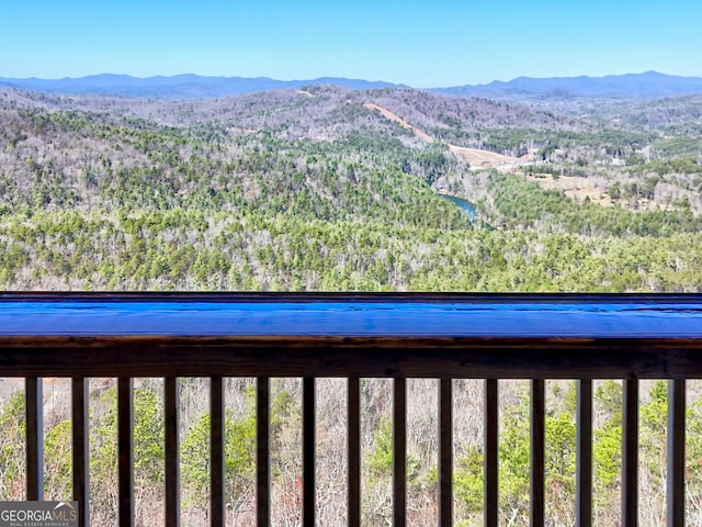 view of mountain feature with a forest view