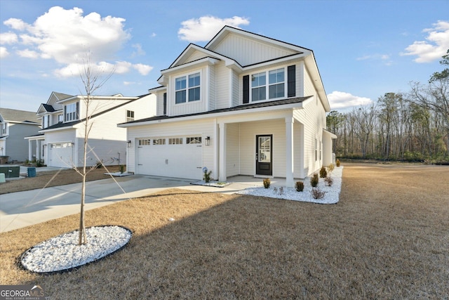 view of front of house featuring a garage and concrete driveway