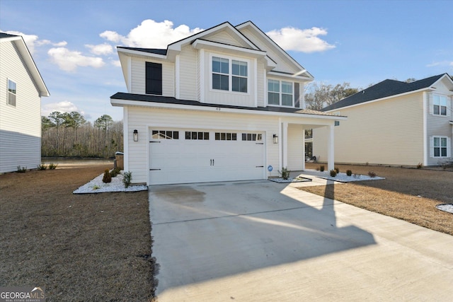 view of front of house with driveway and a garage