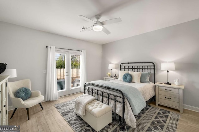 bedroom featuring french doors, light wood-type flooring, ceiling fan, and access to outside