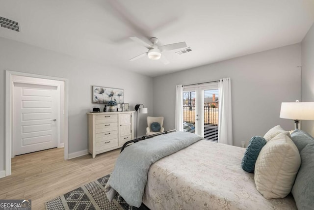 bedroom featuring visible vents, baseboards, light wood-style floors, and access to outside