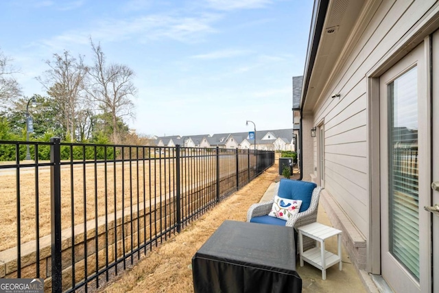 exterior space with central air condition unit, a fenced backyard, and a residential view