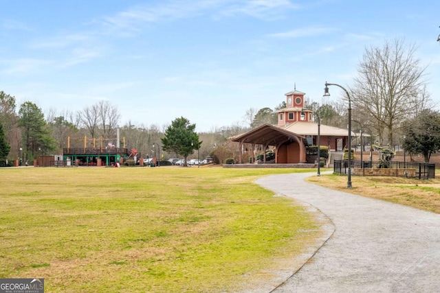 view of home's community with a yard