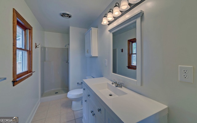 bathroom featuring a shower, visible vents, toilet, vanity, and tile patterned flooring