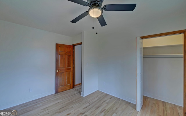 unfurnished bedroom with baseboards, a closet, and light wood-style floors