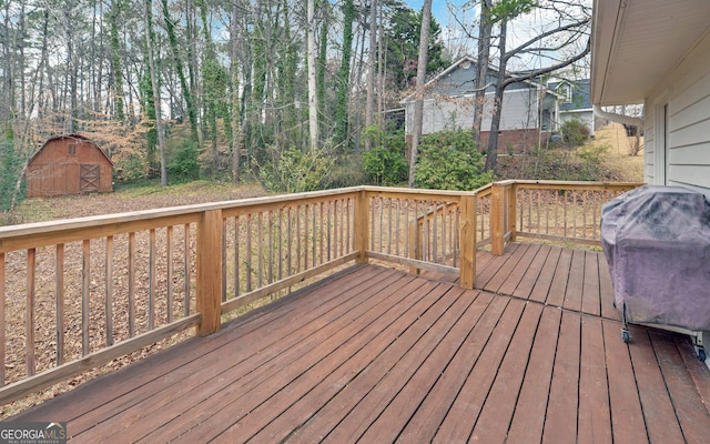 deck featuring a shed and an outbuilding