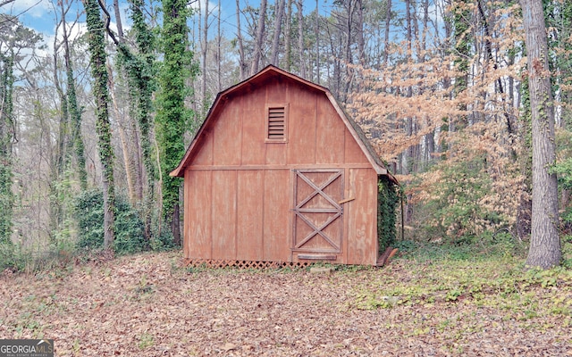 view of shed featuring a forest view