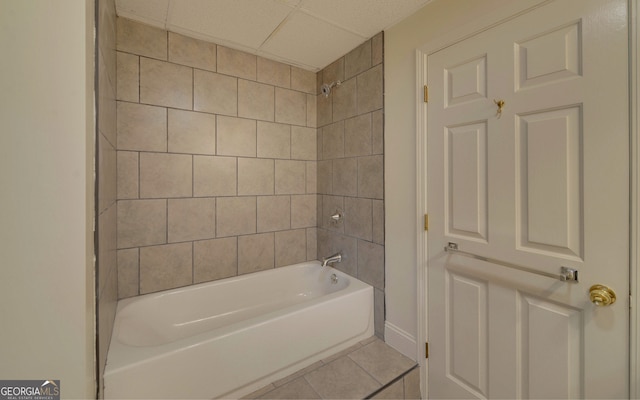 bathroom with bathtub / shower combination and tile patterned flooring