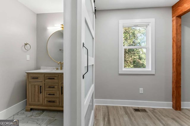 bathroom with visible vents, marble finish floor, vanity, and baseboards