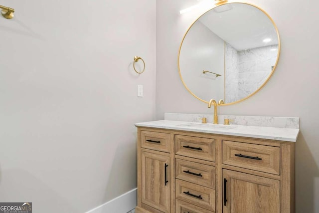 bathroom featuring vanity and baseboards