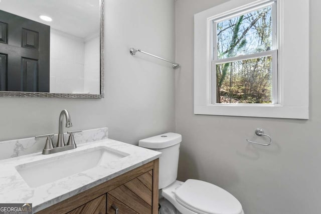 bathroom with vanity and toilet