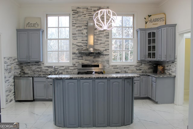 kitchen with wall chimney range hood, gas range oven, marble finish floor, and gray cabinetry