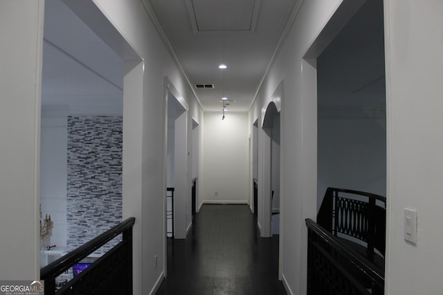 corridor featuring recessed lighting, visible vents, dark wood-type flooring, and attic access