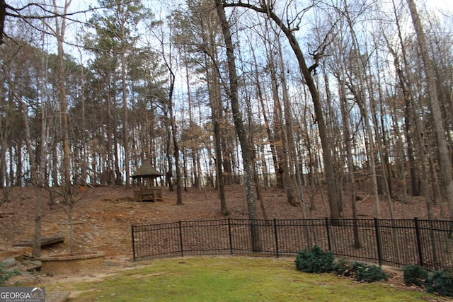 view of yard featuring a playground and fence