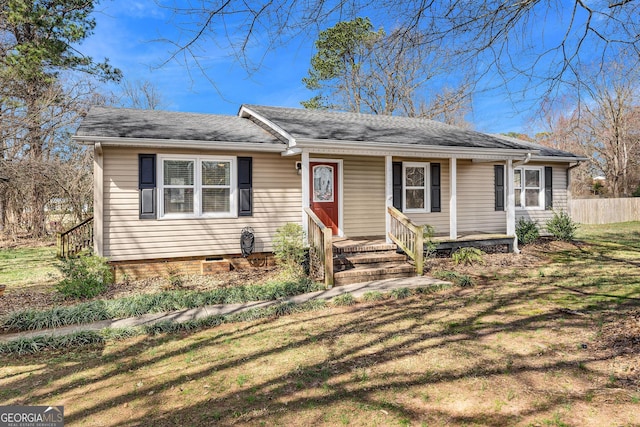 ranch-style house featuring crawl space and fence