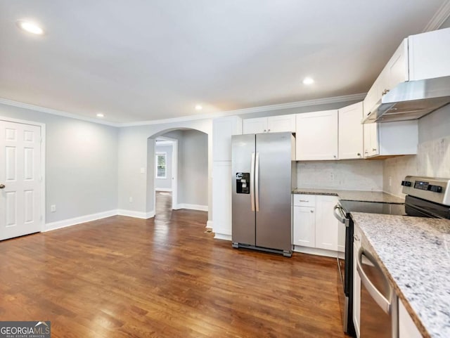kitchen featuring under cabinet range hood, appliances with stainless steel finishes, arched walkways, and dark wood finished floors