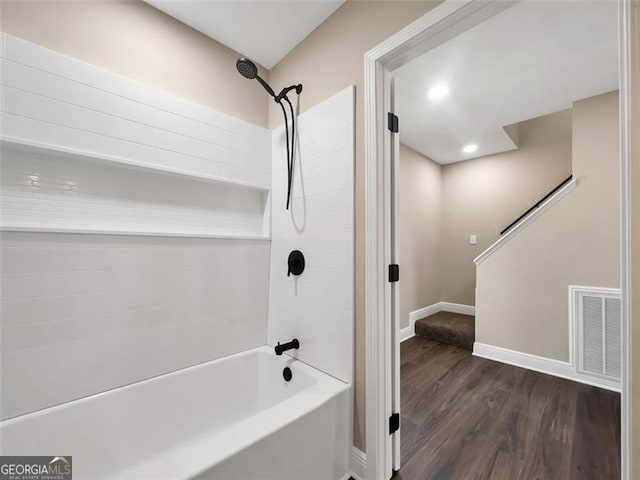 bathroom featuring recessed lighting, wood finished floors, bathing tub / shower combination, visible vents, and baseboards