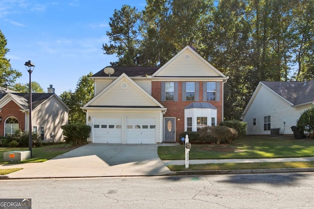 traditional home with an attached garage, cooling unit, brick siding, driveway, and a front lawn