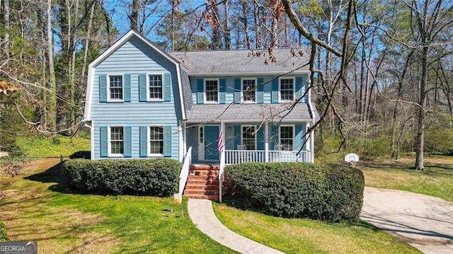 view of front facade with a porch and a front yard